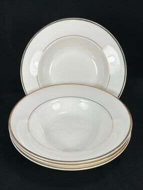set of 4 rimmed soup bowls. Mikasa Cameo Gold